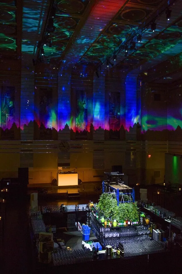 Design Exchange Gala ceiling view of the Trading Floor lit with audio-reactive starscape projection, VJs performing from the second-floor balcony