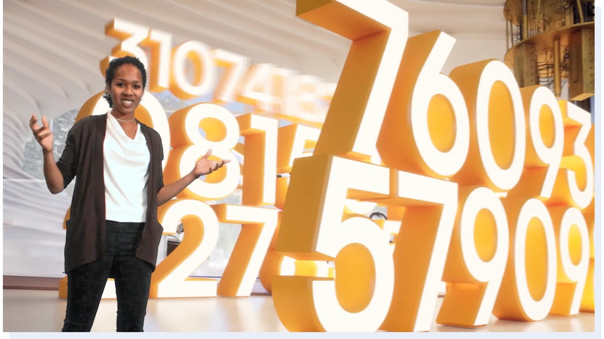SandboxAQ virtual production segment featuring large-scale numerical data visualization on screen